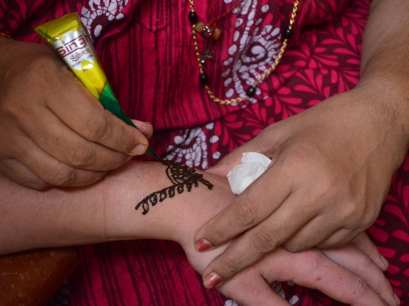 Henna or Mylanji is a form of body art in which decorative designs are created on a person's body, using a paste, created from the powdered dry leaves of the henna plant 