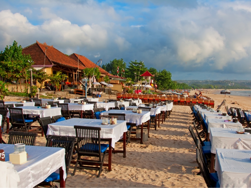 Relaxing-beach-view-in-Jimbaran-with-restaurant-on-the-sand