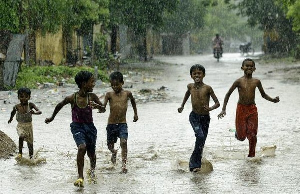 Children Playing in Monsoon Rains in Kerala